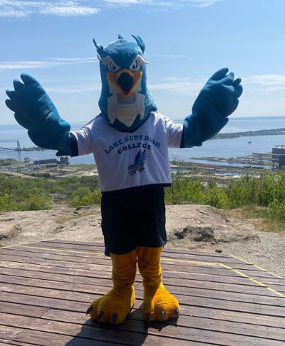 HawkEye the Lake Superior College Mascot overlooking Duluth, Minnesota