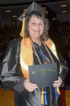 Graduate with diploma