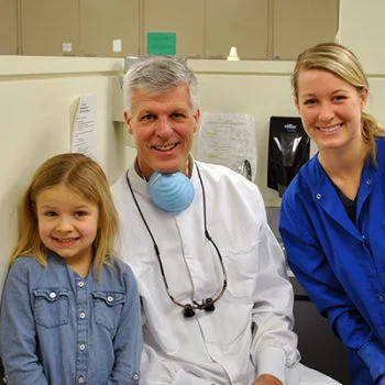 girl, dentist, hygienist smile at camera