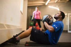 Man lifting a weighted ball